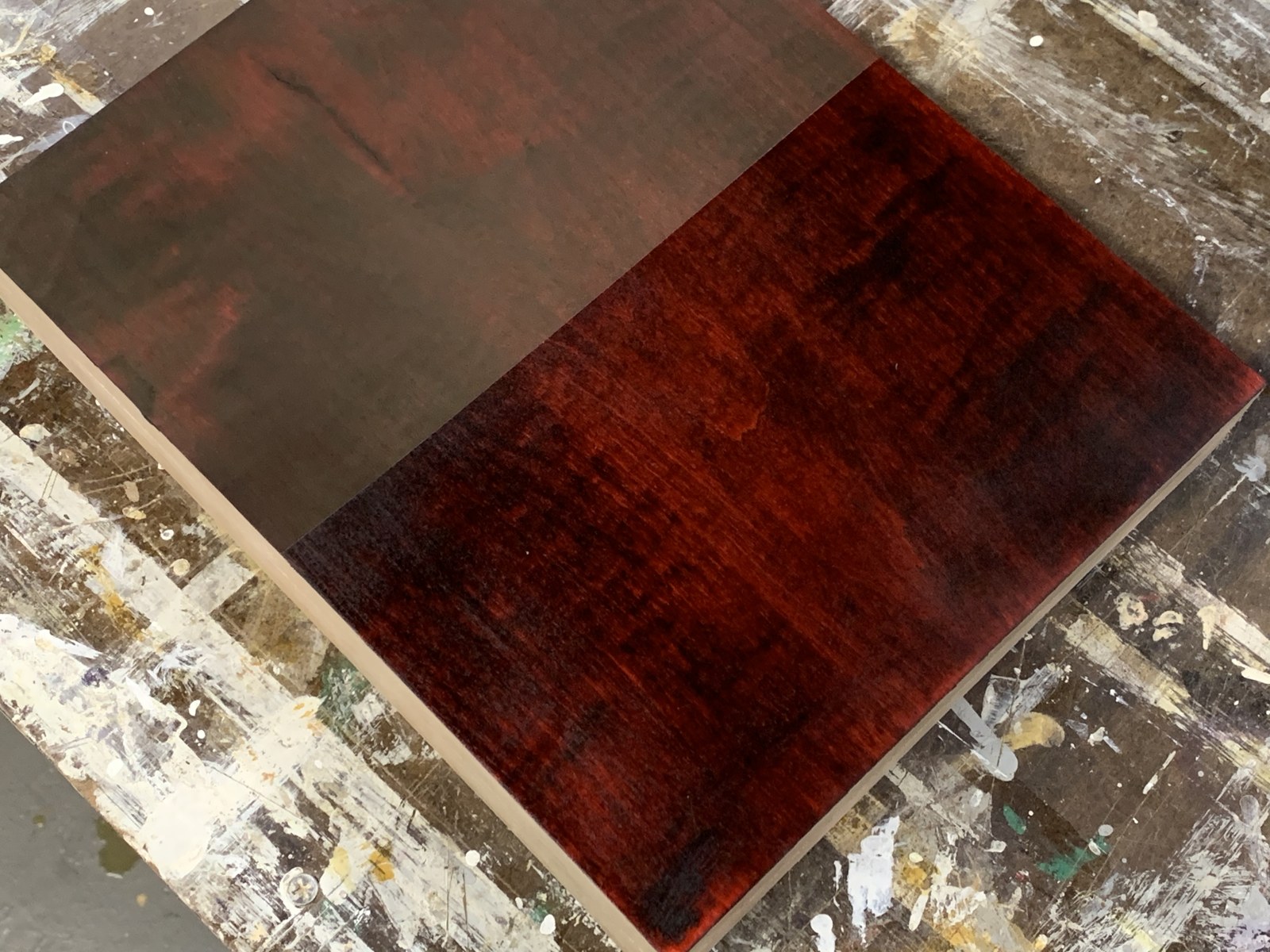 Red and dark dye experiment on a sample piece of wood